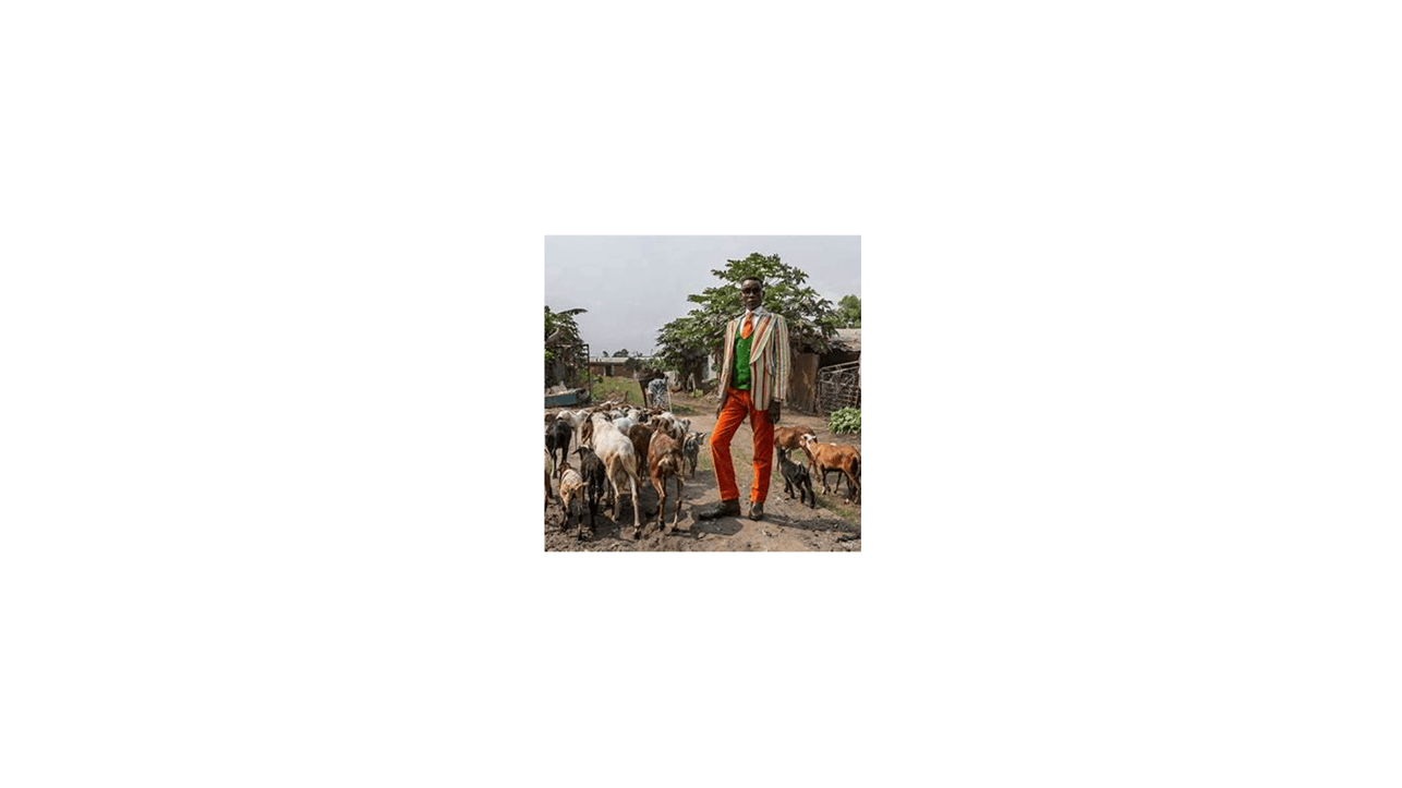 IMAGE & SOURCE: Maxim, 43, has been a sapeur since he was seven years old. He mixes labels such as Yves Saint Laurent, Pierre Cardin and Christian Dior with suits that he has designed and made himself. Now married with two children, he teaches others the art of how to dress elegantly. Brazzaville, Republic of the Congo. SOURCE: © Tariq Zaidi