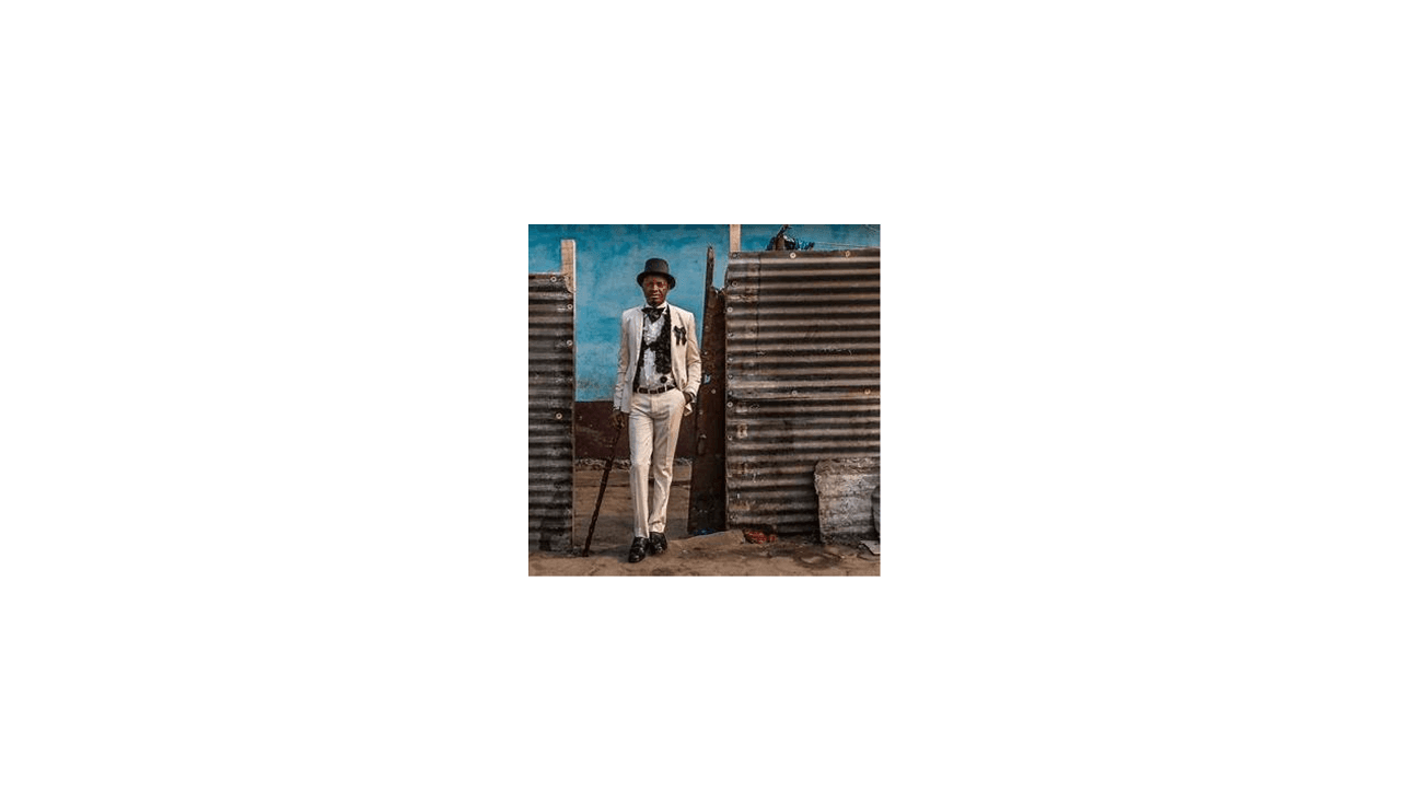 IMAGE & SOURCE: Kass, 42, has been a sapeur for 20 years. He has three children and sells clothes in a small shop. His favourite item of clothing is his J.M. Weston shoes, which can cost hundreds of dollars. Brazzaville, Republic of the Congo. SOURCE: © Tariq Zaidi